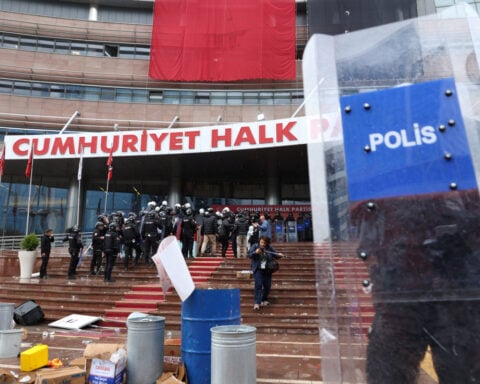 Turkish police force ousted opposition out of headquarters as crisis deepens