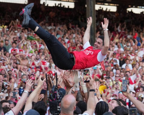 Kroenkes enjoy 'magical' title win as Arsenal's players finally get hands on Premier League trophy