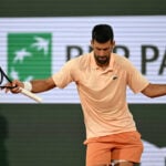 Novak Djokovic overcomes a slow start and hostile crowd in 1st-round win at French Open