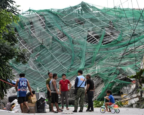 Philippine rescuers racing against time a day after deadly building collapse