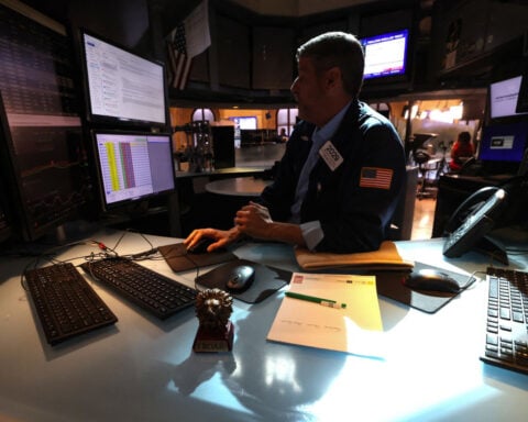 Near record highs, stocks face fresh test from bond yields
