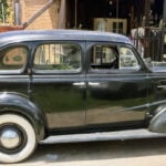 Family driving World War I veteran's car in Route 66 Capital Cruise