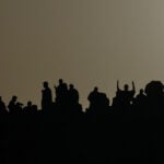 Muslim pilgrims converge on Mount Arafat in Saudi Arabia as the Hajj reaches its peak