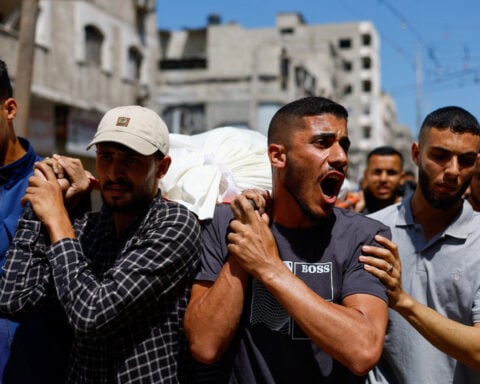 Palestinians mourn slain Hamas militant chief as Israel escalates Gaza attacks