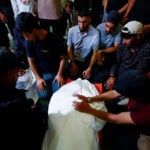 Palestinians mourn slain Hamas militant chief as Israel escalates Gaza attacks