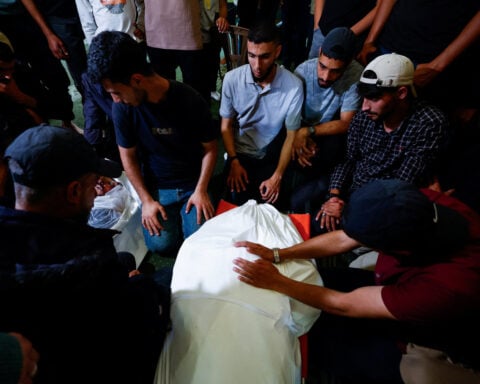 Palestinians mourn slain Hamas militant chief as Israel escalates Gaza attacks