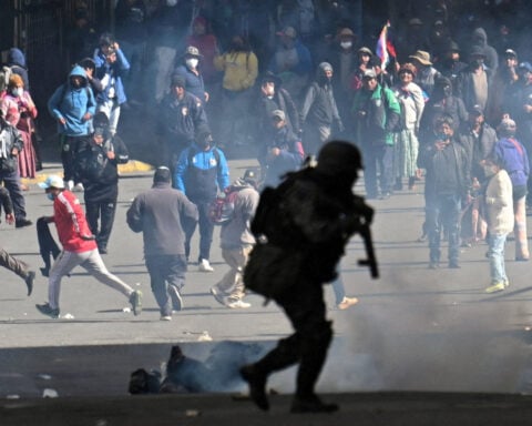 Bolivia clears path to send troops onto streets to calm protests