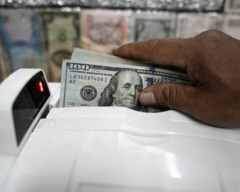 Dollar set to weaken long-term, Europe has work to do, JPMorgan AM, Euroclear execs say