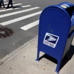 US Postal Service suspends non-essential spending amid cash crunch