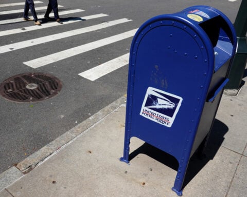 US Postal Service halts non-essential spending as cash crisis deepens