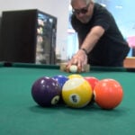 Man creates game of blind billiards for his community