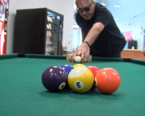 Man creates game of blind billiards for his community