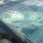 Mother struggles after inflatable display damages car during windstorm
