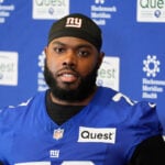 Giants restructure left tackle Andrew Thomas' contract to clear cap space, AP source says