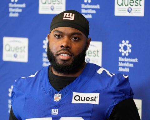 Giants restructure left tackle Andrew Thomas' contract to clear cap space, AP source says