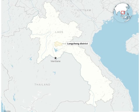Rescuers evacuate the first of 5 villagers found trapped in a cave in Laos; 2 still missing