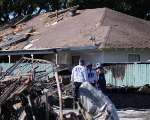Crews scour the site of a deadly Dallas apartment blast and fire searching for more possible victims