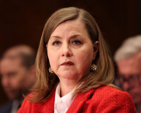 Fed officials mull raising rates to curb growing inflation risk