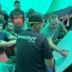 Survivor rescued from flooded Laos cave but remaining group faces another night underground