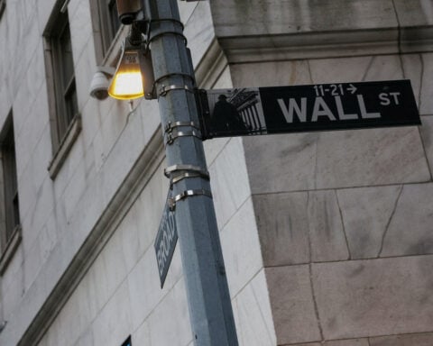 Stocks hold near record highs as AI optimism trumps Iran tensions