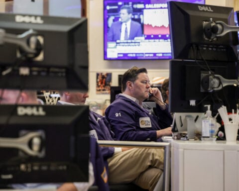 Wall St opens near record highs as AI optimism counters US-Iran war worries