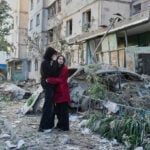 Russian attack on Ukraine capital kills at least 3 and traps others in damaged buildings