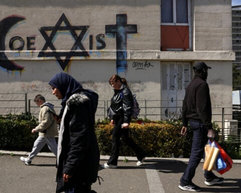 In France's poor, diverse suburbs, Melenchon's hard left charts a path to the presidency