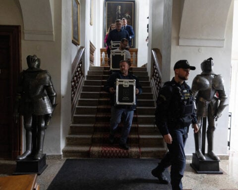 Czech castle's cache of precious wine goes on display in new-old bottles