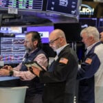 Wall Street slips at open after record highs; HPE soars