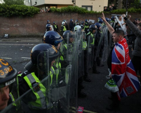 UK police under pressure after dying student was handcuffed