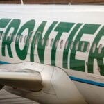 Frontier passenger chokes off-duty flight attendant after trying to open exit door and cockpit on Chicago flight, police say