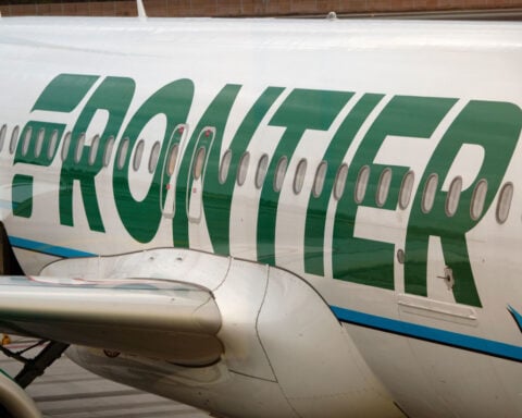 Frontier passenger chokes off-duty flight attendant after trying to open exit door and cockpit on Chicago flight, police say