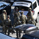 FBI fatally shoots a man holding hostages in a California office building, police say