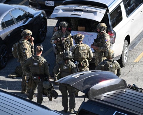 FBI fatally shoots a man holding hostages in a California office building, police say