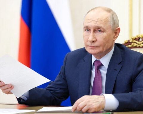 Putin faces rival visions of war and peace at Russia's 'Davos'