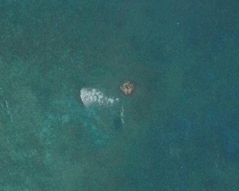 Satellite images show suspected structure at disputed South China Sea atoll, but later gone