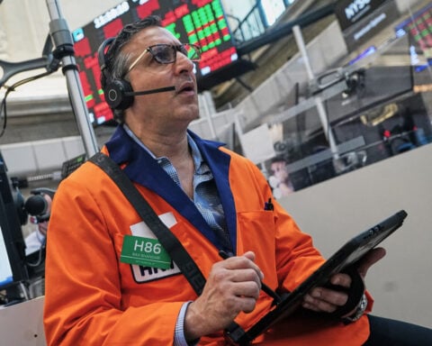 The Dow leaps to a record as oil prices ease and US stocks outside of AI rally