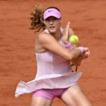 Kostyuk of Ukraine and Andreeva of Russia pose separately for pre-match photo at French Open