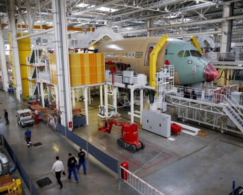 Qantas weighs order for 20 Boeing or Airbus wide-body jets, sources say