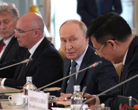 Putin faces rival visions of war and peace at Russia's 'Davos'