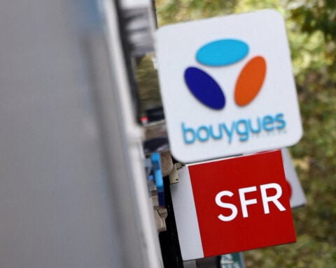 Bouygues-led consortium signs $23.44 billion deal to buy SFR from Altice France
