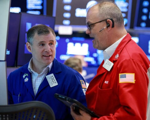 Wall St opens higher as chip stocks rebound, Middle East tensions ease