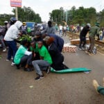 Kenya police fire tear gas, arrest ex chief justice at national park protest