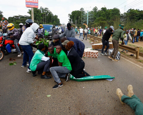 Kenya police fire tear gas, arrest ex chief justice at national park protest