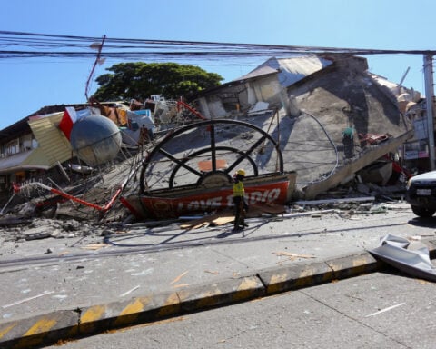 Rescuers race to reach trapped after powerful quake in southern Philippines