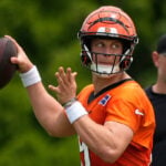 Bengals restructure Joe Burrow's contract to free up cap space, AP source says