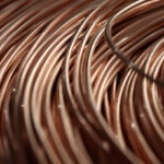 Copper edges down as macro concerns weigh on tariff support