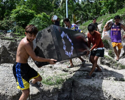 Rescuers race to reach trapped after powerful quake in southern Philippines