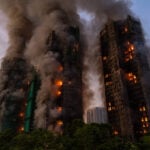 Hong Kong charges 7 people and 2 firms over deadly fire that killed 168