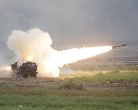 Taiwan fires rockets in China's direction from a US-supplied mobile launching system in drill